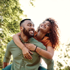 Man giving his wife a piggy back
